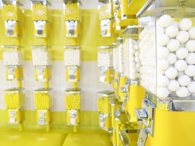 White candy in yellow vending machines